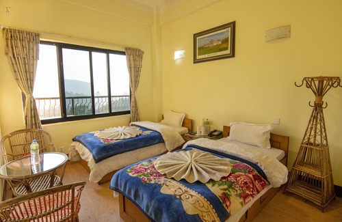 Nagarkot Hotel | Hotel Marigold with panoramic view of mountain range and temperate forest
