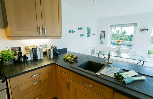 Caergeiliog Cottage | House on the Beach - an on the beach that sleeps 9 guests in 4 bedrooms