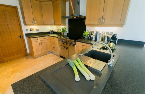 Caergeiliog Cottage | House on the Beach - an on the beach that sleeps 9 guests in 4 bedrooms