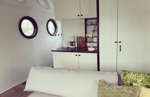 Lathum Boat Rental | Houseboat in Lathumse Plas with Harbor Views