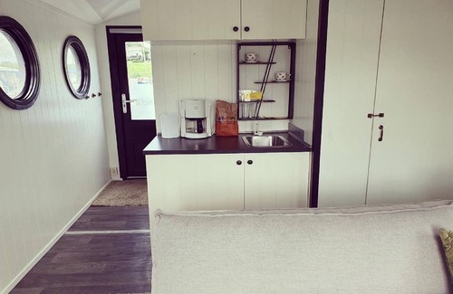 Lathum Boat Rental | Houseboat in Lathumse Plas with Harbor Views