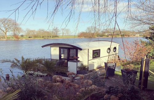 Lathum Boat Rental | Houseboat in Lathumse Plas with Harbor Views