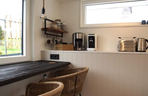 Otterndorf Boat Rental | Houseboat with hot tub, sauna, wood-burning stove, air conditioning, lounge, sun deck and garden with dinghy directly behind the dike in Otterndorf