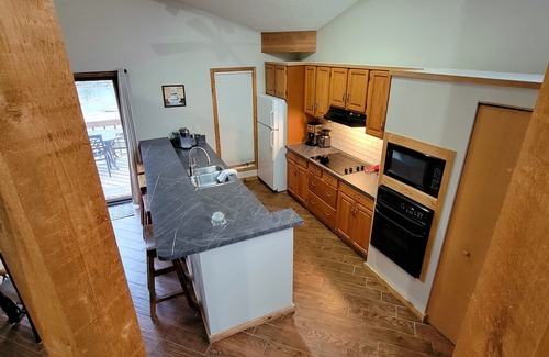 Mancelona Condo | Huge! 2brm KING bed, 2bath sleeps 4 adults only WIFi,Close to Torch Lake, pool