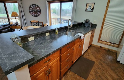Mancelona Condo | Huge! 2brm KING bed, 2bath sleeps 4 adults only WIFi,Close to Torch Lake, pool