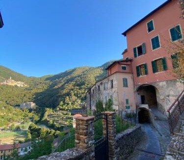 Pigna Villa | Iconic Italian Townhouse w Rooftop Terrace & Mountain View, Pigna
