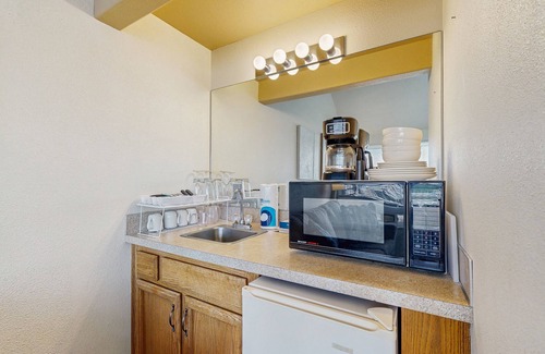 Historic Bayfront Condo | Ideal getaway on the water with private balcony, cozy layout, and free WiFi