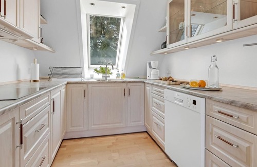Sabro Apartment | Inviting vacation home with wood stove and grounds, located in a cozy town outside Arhus.