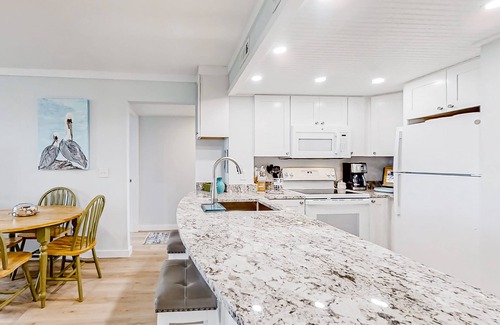 Edisto Island Condo | Inviting waterfront condo with marsh view, pool, balcony, central AC, & W/D