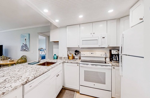 Edisto Island Condo | Inviting waterfront condo with marsh view, pool, balcony, central AC, & W/D