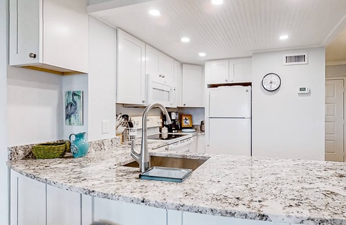 Edisto Island Condo | Inviting waterfront condo with marsh view, pool, balcony, central AC, & W/D