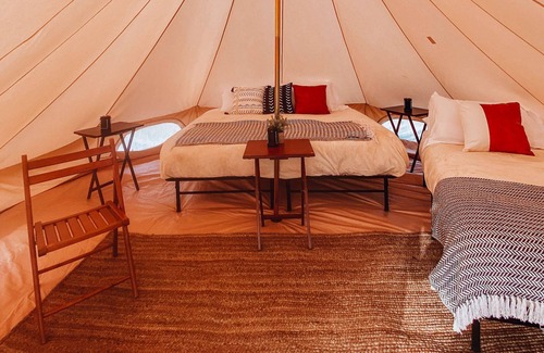 Tropic House | King Tent w/Shared Bathroom - Beauty awaits you just past the red cliffs.