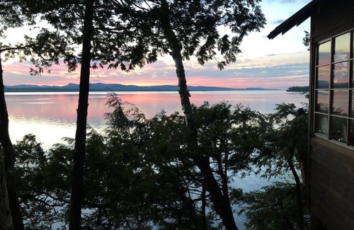 Charlotte Cabin | Lake Champlain camp, spacious deck, sunset & mountain views, beach and dock