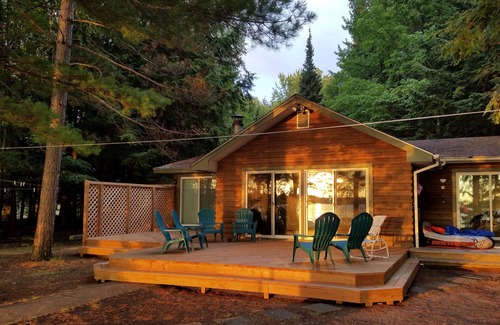 Three Lakes Cabin | Lake House w/Spectacular Sunset Views -100 ft FLAT Lakefront; Large dock, SAFE -