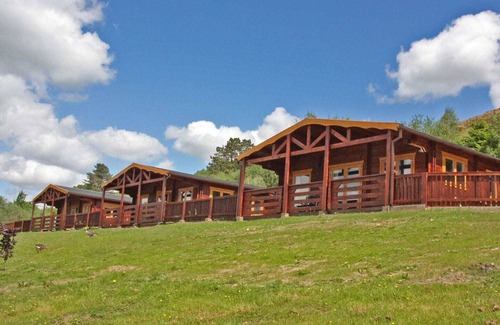 Pontardulais Cottage | Lake side log cabin peacefully situated and each enjoying fabulous lake views.