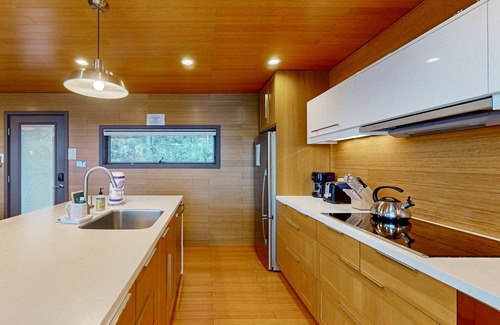 Valois House | Lakefront contemporary gem with decks, lake views & pebble beach
