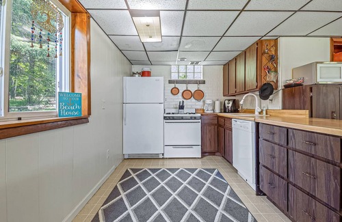 Johannesburg House | Lakefront home with large yard, dock, gas grill, WIFI near golf & ATV trails!