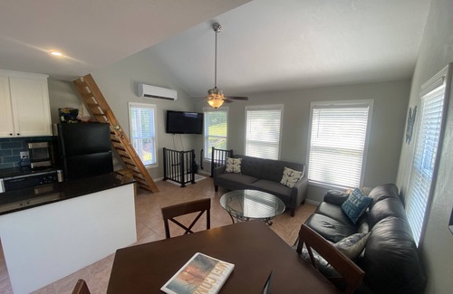 Gravois Mills House | Lakefront house with large deck, private boat dock, and covered outdoor games!