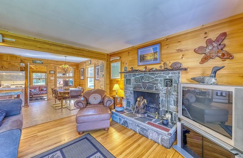 Brant Lake House | Lakefront house with 275' of waterfront, enclosed porch, & firepit