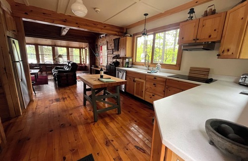 Town of Hermon Cottage | Lakeside Cottage near Adirondacks, Hot Tub, Pontoon Boat, Kayaks & Paddle Board