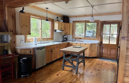 Town of Hermon Cottage | Lakeside Cottage near Adirondacks, Hot Tub, Pontoon Boat, Kayaks & Paddle Board