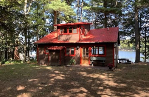 Town of Hermon Cottage | Lakeside Cottage near Adirondacks, Hot Tub, Pontoon Boat, Kayaks & Paddle Board