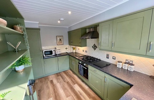 Ampney Crucis House | Lakeside Windrush Turret Lodge with Hot Tub Family Friendly On-site Facilities