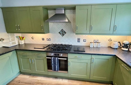 Ampney Crucis House | Lakeside Windrush Turret Lodge with Hot Tub Family Friendly On-site Facilities