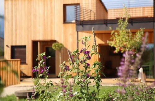Sarnonico House | Landhaus Silene: new + modern wooden house with large natural garden and swimming pond