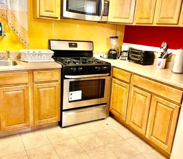East New York House | Large 3-Bedrooms/2-Bath Apt, One Block to Train