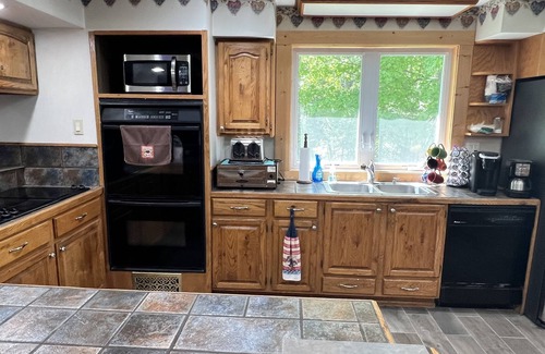 Amberg House | Large cottage right on ATV & snow trails. Close to Dave’s Falls! Pet friendly!