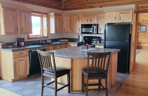 Hulett House | Large garage for bikes. Beautiful log home. On golf course.
