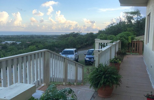 Estate Whim House | Large hillside one bedroom apartment with a sea view.