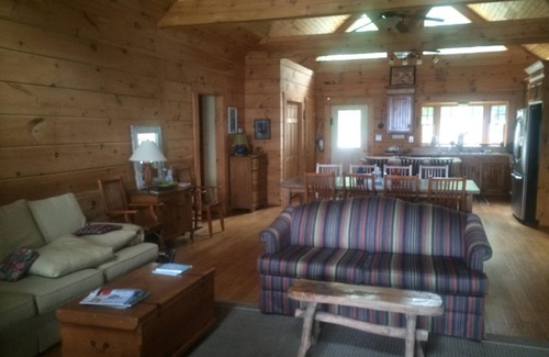 Gilbert House | Large Log Cottage: Green Grass, Blue Skies, Lake Living
