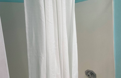 Briarforest House | Large room with attached bathroom in the energy corridor area