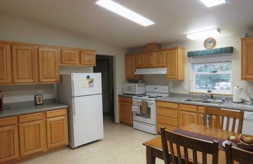 Priest River House | Located in a private wooded area with a lovely creekfront trail to explore.
