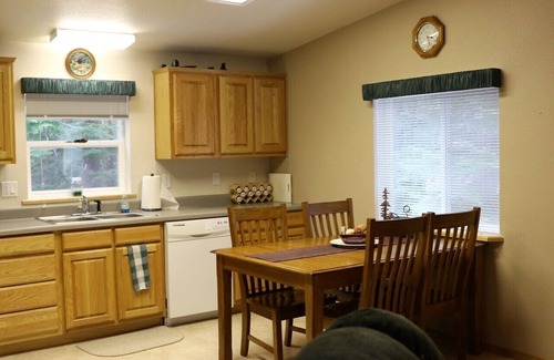 Priest River House | Located in a private wooded area with a lovely creekfront trail to explore.