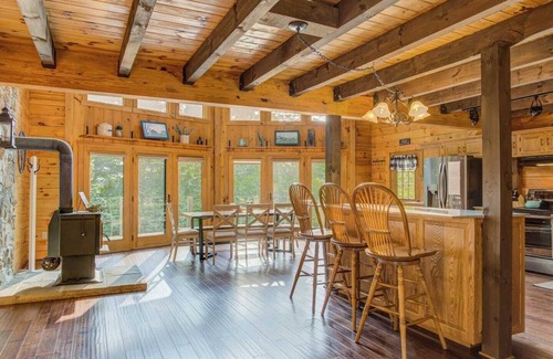 Cedarhurst Cabin | Log Cabin with living room fireplace and hot tub