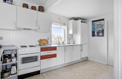 Skastrup Strand House | Look forward to relaxation and proximity to the beach in this cozy vacation home.
