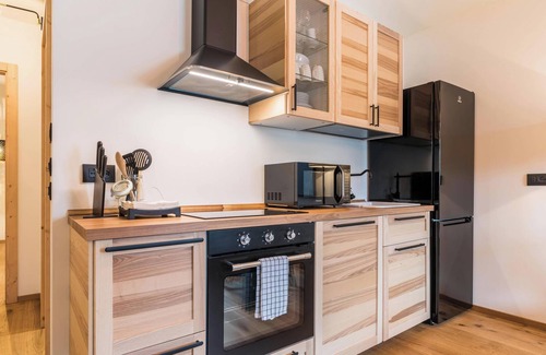 Levico Terme Apartment | Lovely Apartment “Wellness Lodge Diletta” with Lake View, Balcony, Whirlpool & Sauna