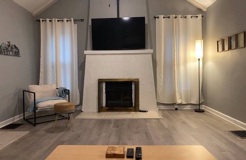 Indianapolis House | Lovely homey pad near Irvington with huge sofa, electric fireplace & porch swing
