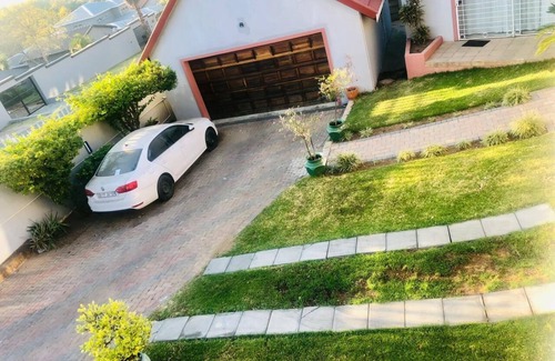 Randpark Ridge House | Lovely Studio Apartment sitting on a lovely acreage with natural man made rocks.
