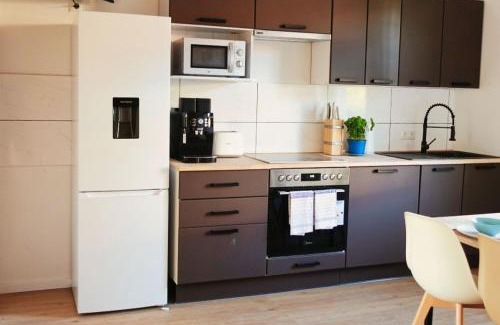 Bahnhofsviertel Apartment | Luvonio Apartments - modern & zentral mit WLAN, 55 Zoll Smart TV & DeLonghi Kaffeeautomat
