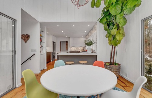 Old Lyme House | Luxurious midcentury modern glass house in the woods, chefs kitchen & great art