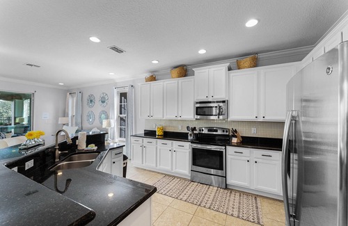 Reunion House | Luxurious pool home with theater 6 miles from Disneyworld