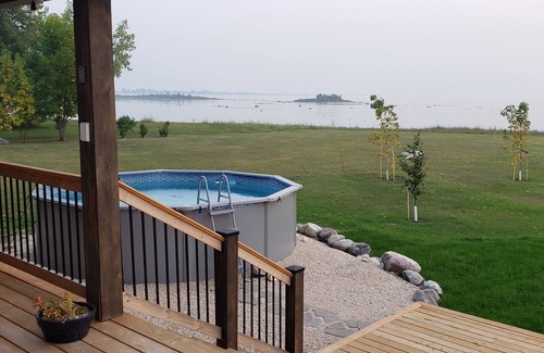 Saint Laurent Cottage | Luxury 1900sf lake front cottage c/w game room, hot tub, pool, near golf course