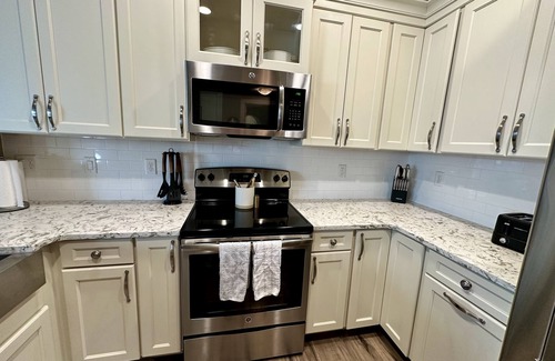 Sherman Hill Condo | Luxury condo. 2 car garage, rooftop patio. Perfect for work or play!