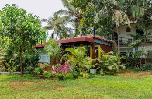 Morjim House | Luxury cottages in lush green panoramic windows