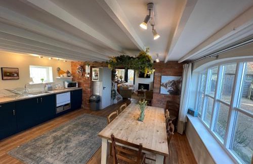 Overton-on-dee House | Luxury homely open-plan Barn with log burner & games room