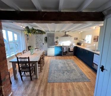 Overton-on-dee House | Luxury homely open-plan Barn with log burner & games room